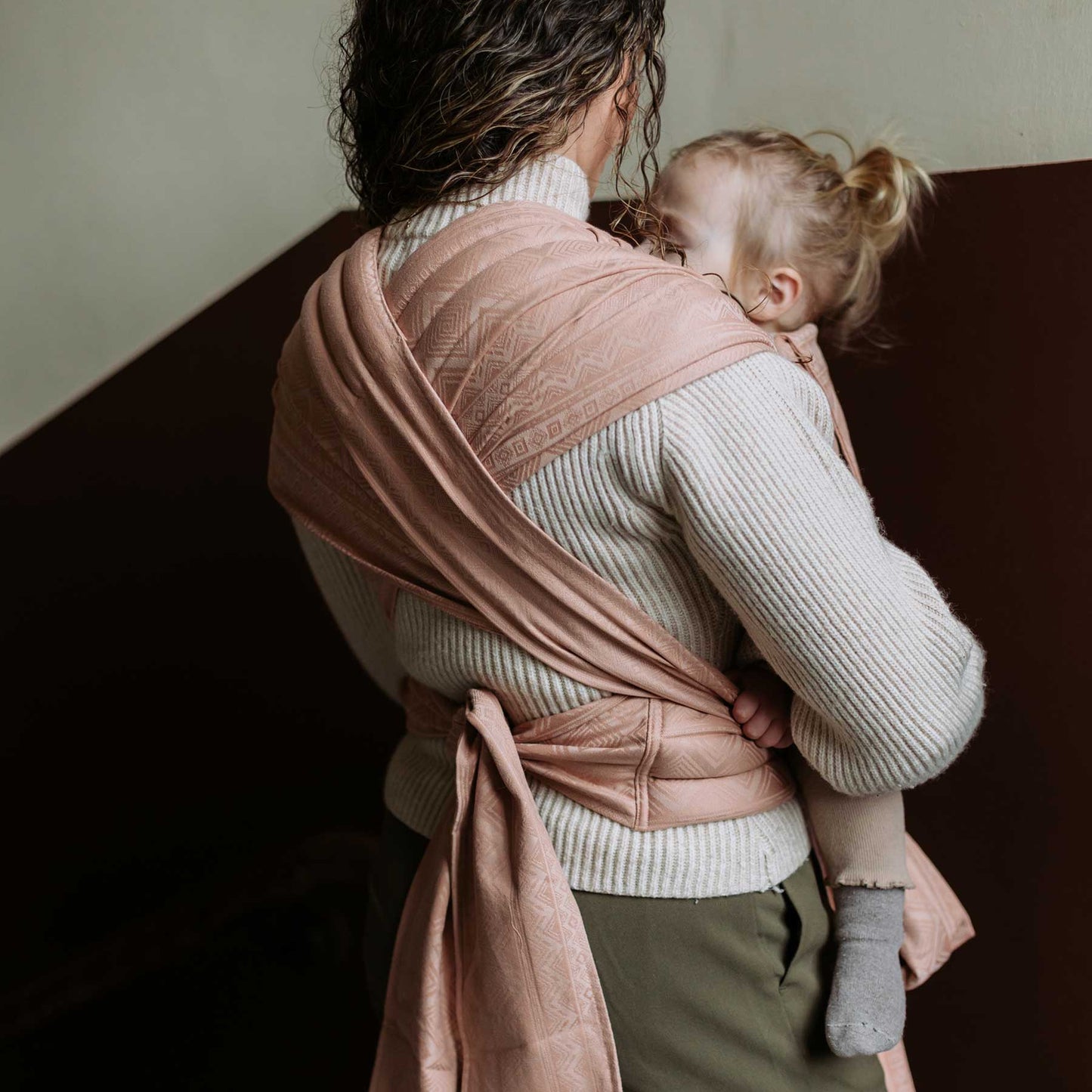 Back view of Fly Tai Mei Tai Sling baby carrier Design Cubic Lines tuscany