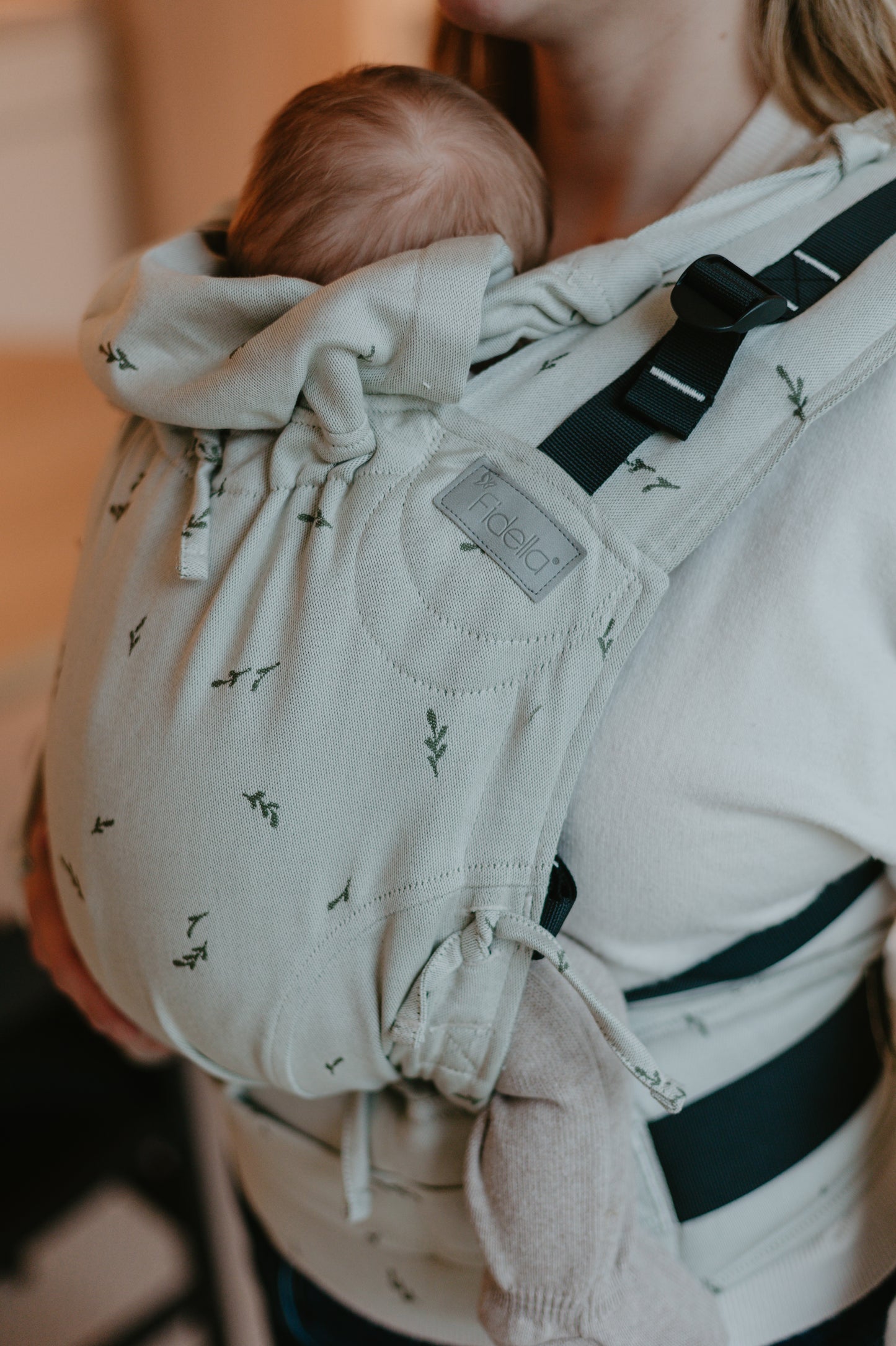 Side view of Fusion Full Buckle Baby Carrier Design Leaves green