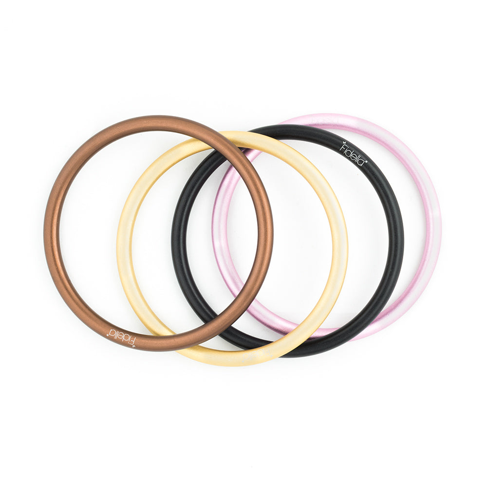 Collection of different colored Sling Rings with the Fidella logo