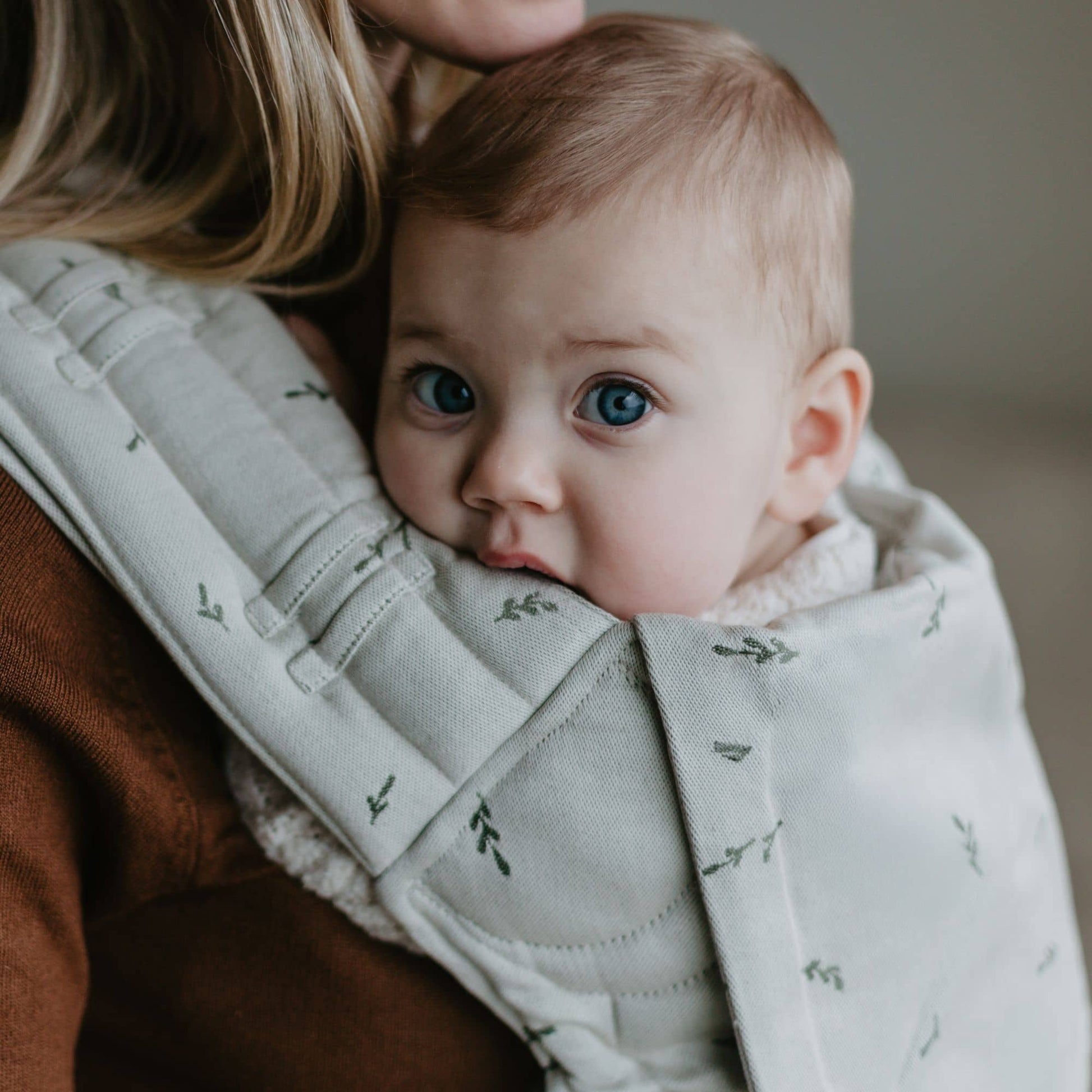 Close up of FlyClick  Half Buckle Baby Carrier Design Leaves  green