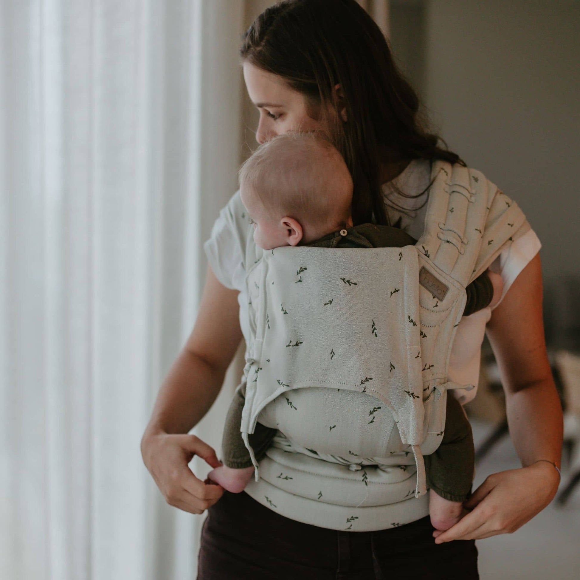 Front view of Fly Tai Mei Tai  Sling baby carrier Design Leaves  green