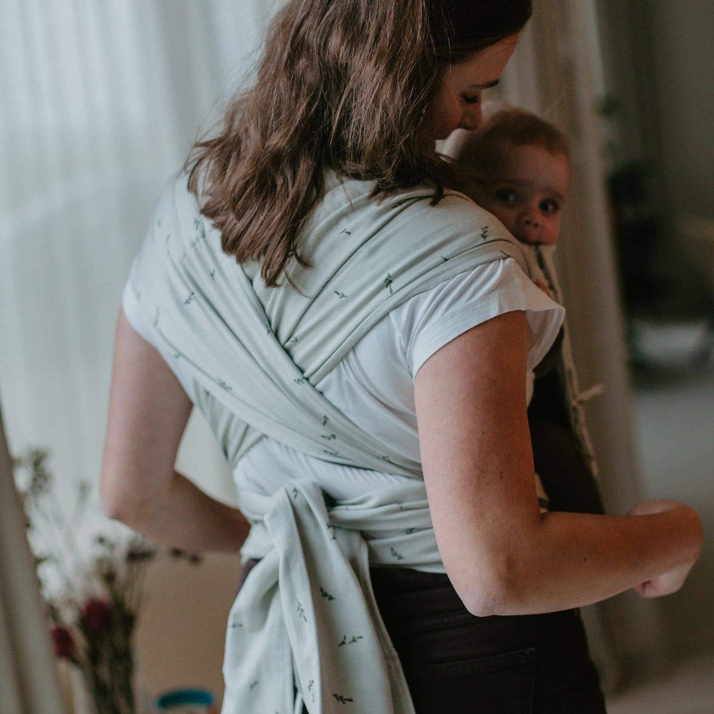 Back view of Fly Tai Mei Tai  Sling baby carrier Design Leaves  green